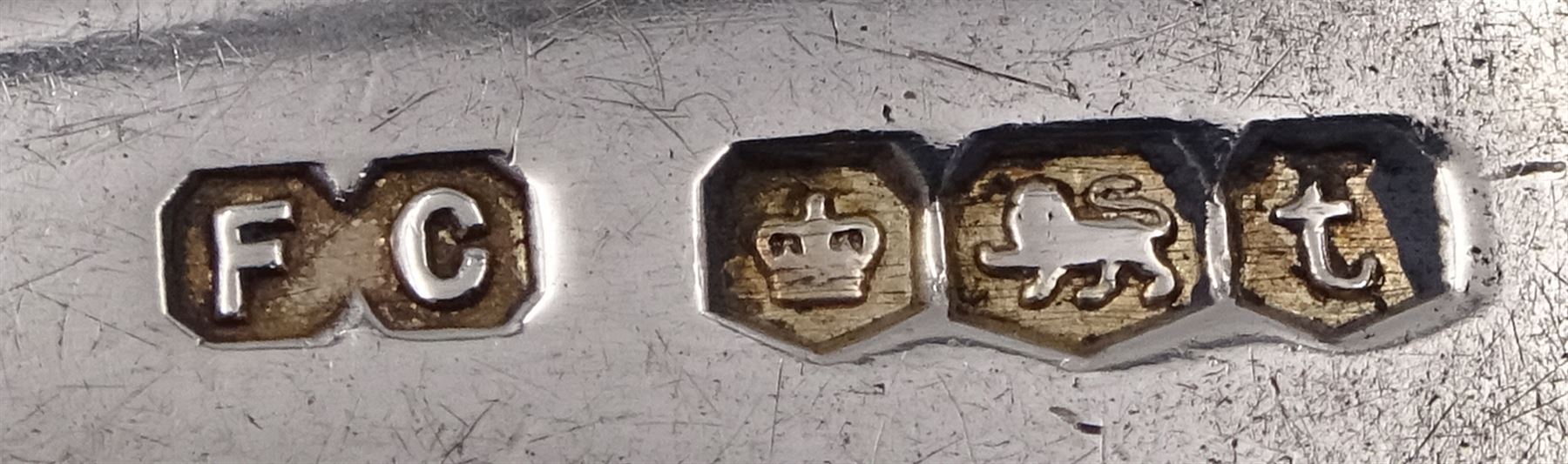 Gorup of silver, comprising pair of Edwardian silver napkin rings, with repousse floral decoration, hallmarked E J Trevitt & Sons, Chester 1903, together with set of three 1930s silver Hanoverian pattern coffee spoons, each with rattail bowls and engraved initial to terminals, hallmarked Frank Cobb & Co Ltd, Sheffield 1936, a pair of early 20th century coffee spoons, each embossed with nesting birds to terminals, with ivy leaf borders and stems, hallmarked Robert James Chaplin & Sons, London 1919, and a Siamese silver mounted cigarette box, with niello work dragon boat scene to cover, lifting to reveal wood lined interior, stamped Sterling Siam, H3.2cm W9.7cm