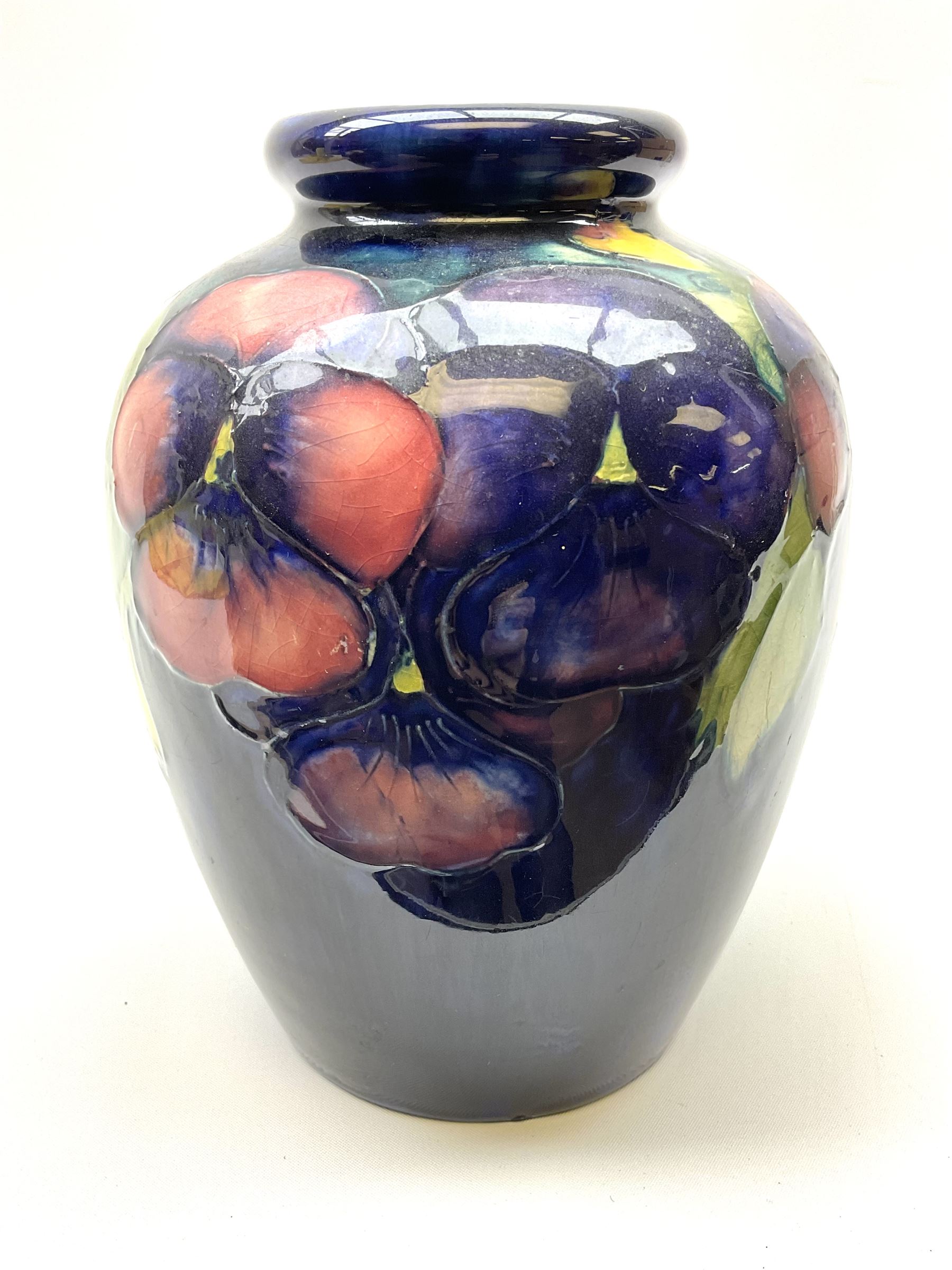 Moorcroft vase of ovoid form, decorated in Pansy pattern upon a dark