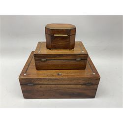 Two rosewood rectangular boxes with mother of pearl inlay decoration, together with a smaller walnut box with canted corners and brass inlay, largest L30cm