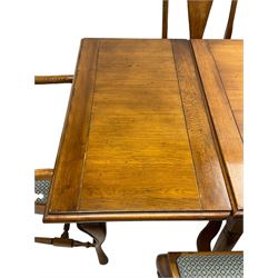 Late 20th century oak dining table, rectangular top with two draw leaf extensions, on turned supports united by moulded hayrake stretchers (180cm - 278cm x 90cm, H76cm); set of eight (6+2) oak dining chairs, shaped cresting rail over shaped splat back, upholster drop-in seat, on cabriole supports united by turned H-shaped stretchers 