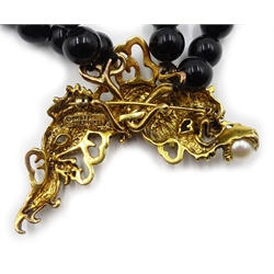 Franklin Mint 'Year of the Dragon' two strand black onyx necklace with detachable silver-gilt brooch set with a pearl and ruby eyes, stamped 925, designed by Kai-Yin Lo ,with certificate