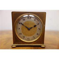  Art Deco small gilt brass cased travelling clock by Zenith, c1930, the silvered chapter ring with Arabic numerals, fixed key wind movement with alarm facility, in original triptych style carrying case, retailed by Fillans and Sons Huddersfield H5.5cm  