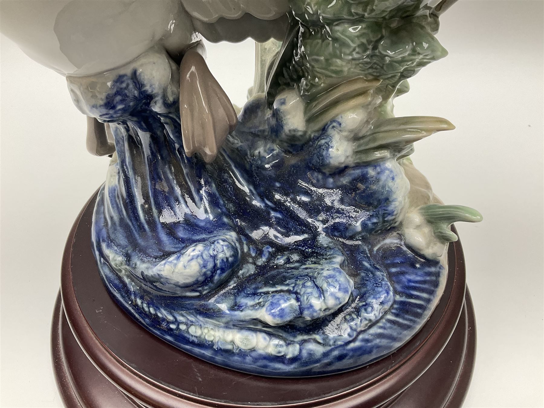 Large Lladro figure group, Swans Take Flight, modelled as two swans upon raised on circular wooden plinth, sculpted by Salvador Debon, H68cm