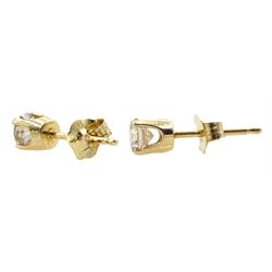 Pair of gold round brilliant cut diamond stud earrings, stamped 14K, total diamond weight approx 0.45 carat