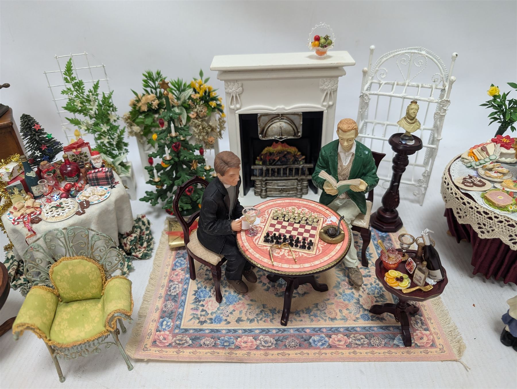 Dolls house furniture, including pianos, fireplace, plants, flower arrangements, tables, chairs, six figures and a collection of instruments and other accessories