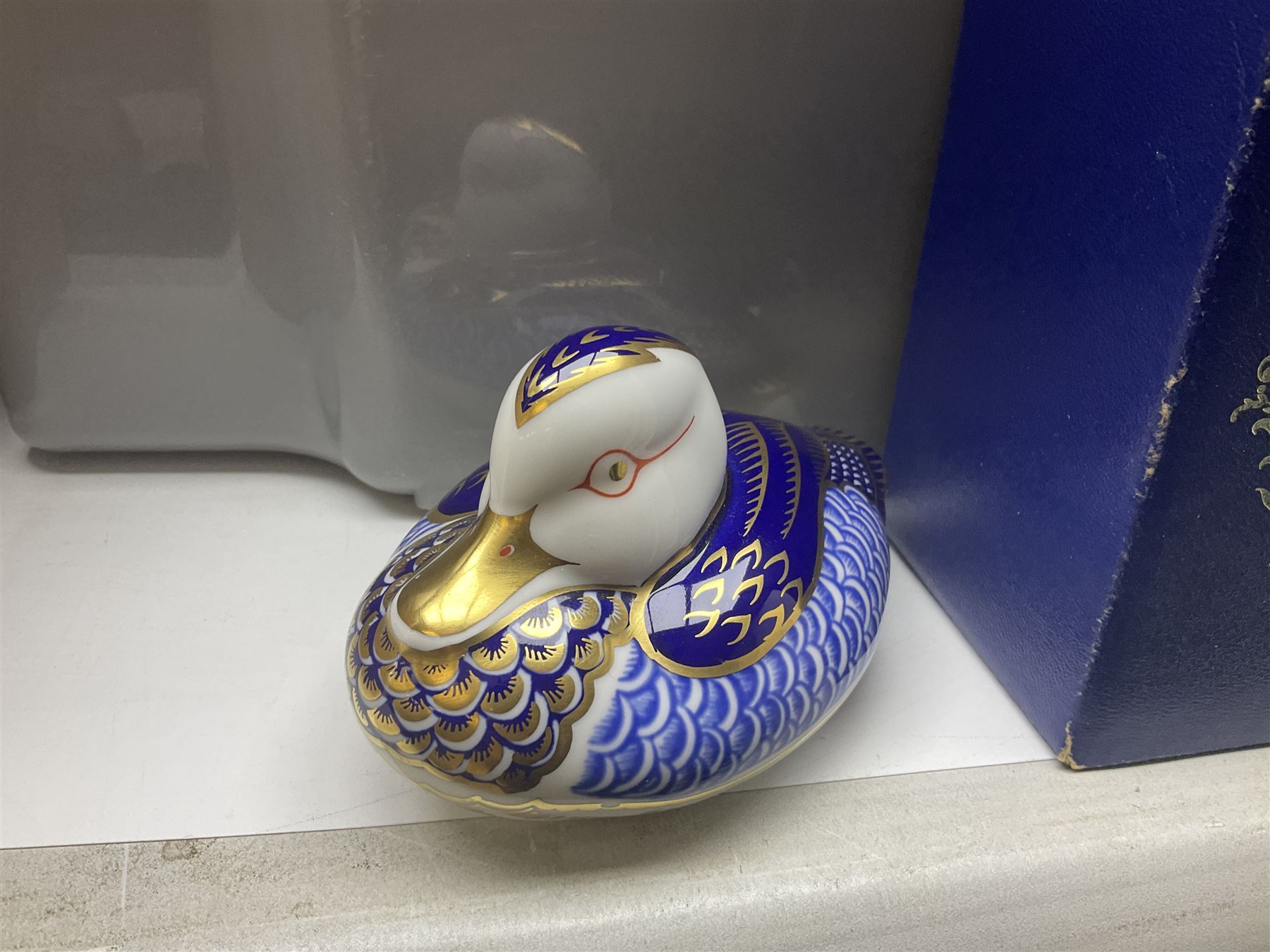 Royal Crown Derby duck, together with Emma Bridgewater mug, Coalport wall plaque and other ceramics and glassware etc, in three boxes 