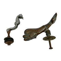 Metal door knocker, as a stylized fish/dolphin, inscribed Malta, together with a car mascot modeled as a pair of seahorses 