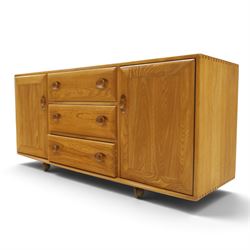 Ercol - mid-20th century light elm and beech Windsor 'model 455' sideboard, rectangular top over three central drawers flanked by cupboards, on castors