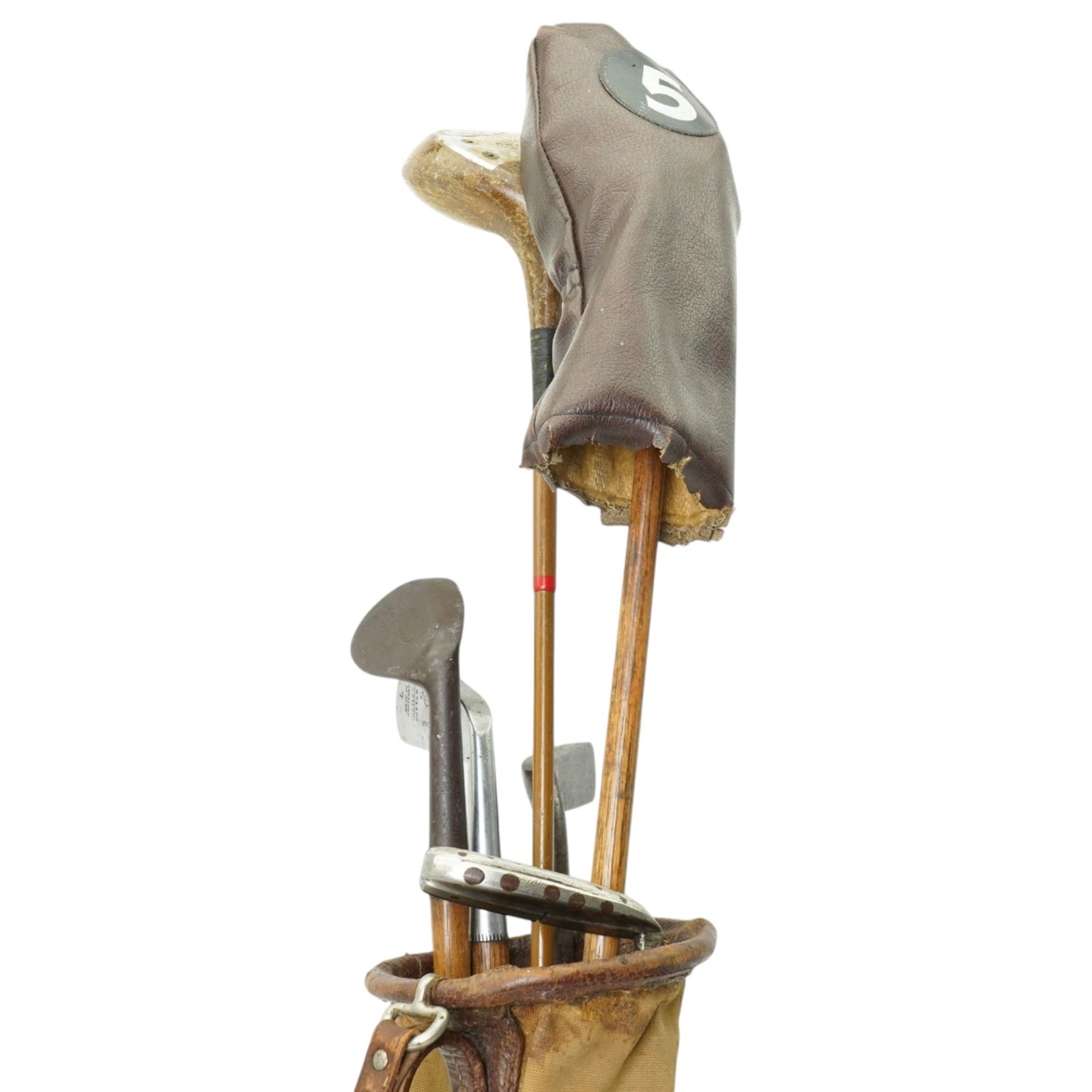 6 Hickory shafted golf clubs including Niblick by Forgan & Son, St Andrews, three putters and two woods in a canvas bag 