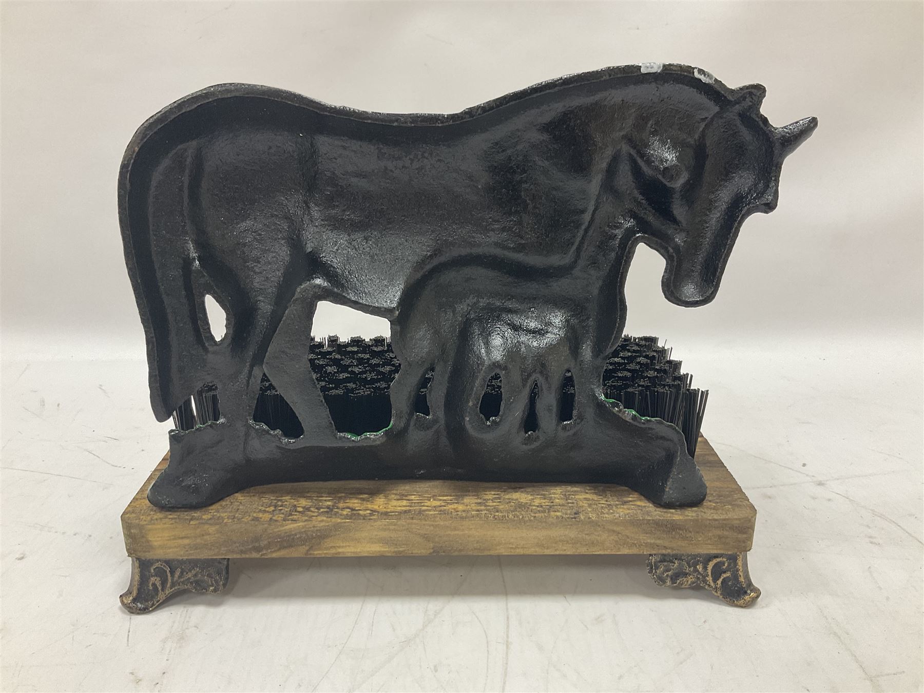 Cast iron horse and foal boot brush on wooden base, H25 cm