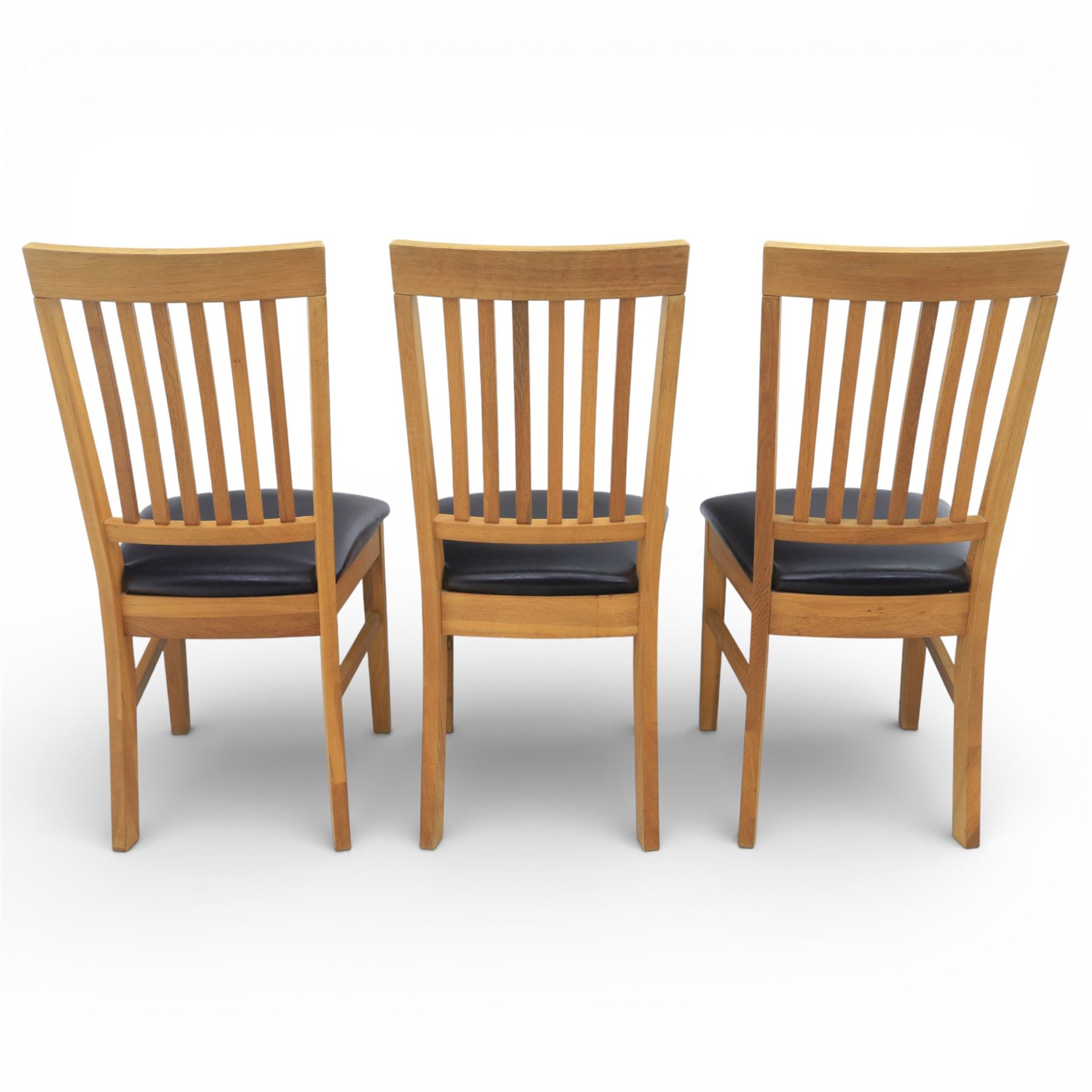 Solid light oak extending dining table with single leaf, and set of six chairs