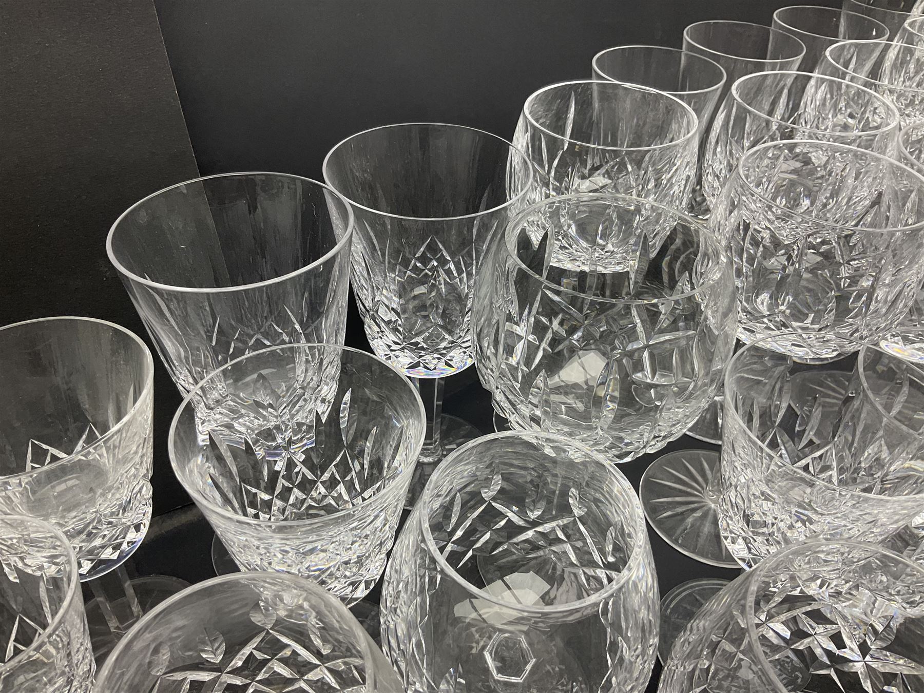Set of Waterford Crystal Lismore pattern drinking glasses for six people, including hock glasses, goblets, champagne flutes,  sherry glasses, liqueur glasses, hi ball glasses, whisky glasses, brandy balloons, etc, all with etched maker's mark beneath  (62)