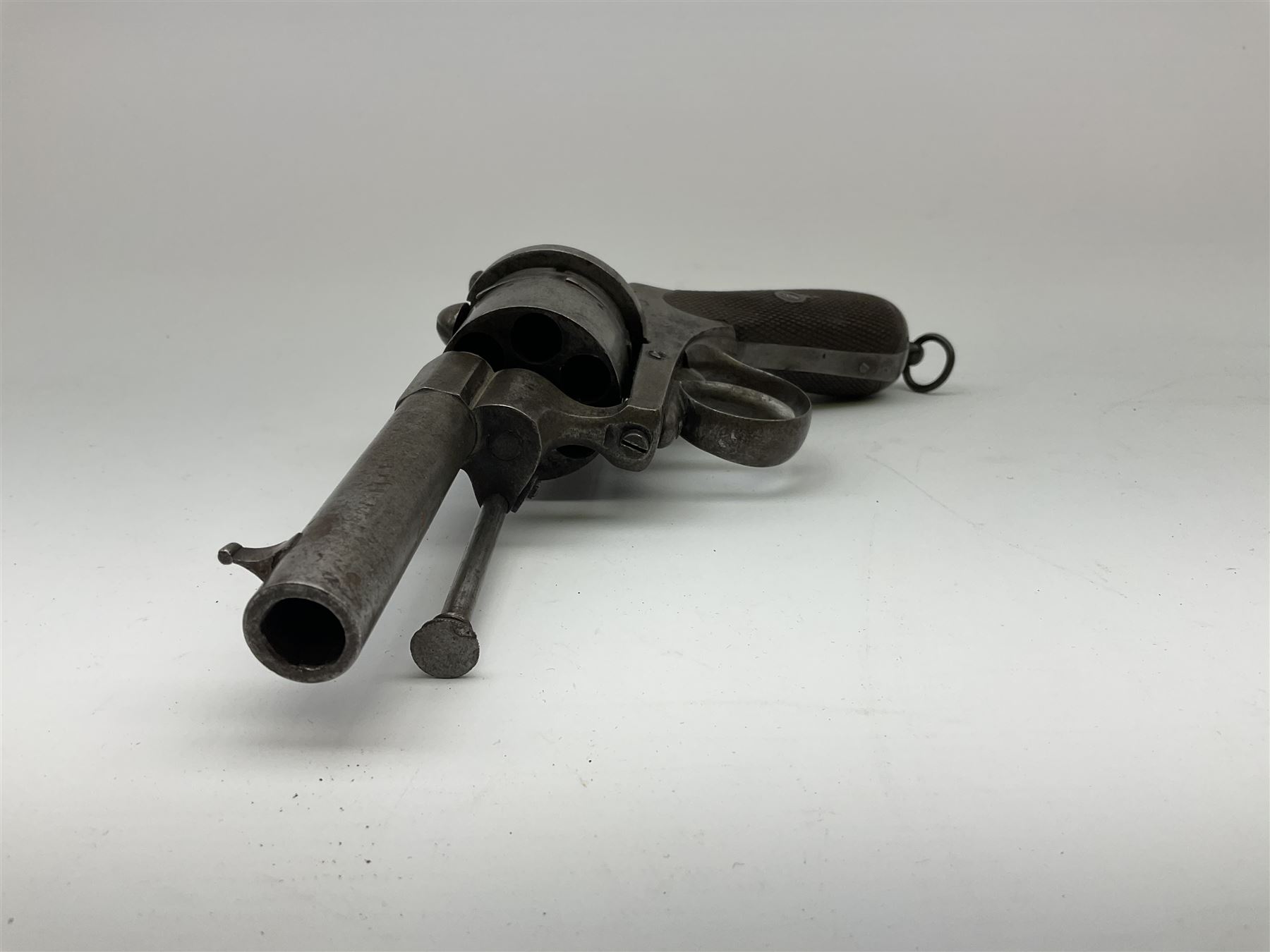 Mid-19th century 12mm (approx. .45cal.) six-shot pin fire revolver with single and double action, bears English proof marks, rifled barrel, fitted ejector rod and chequered walnut split grips L25cm