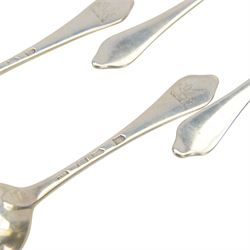 Twelve silver dog nose spoons, comprising a set of eight George II examples with drop heels  and engraved crest to terminals, hallmarked Isaac Callard, London 1732, three with rat tail bowls, circa 1722, hallmarked Samuel Hitchcock, London, date latter worn and indistinct, and a Britannia standard with rat tail bowl, circa 1718, each approximately L20cm