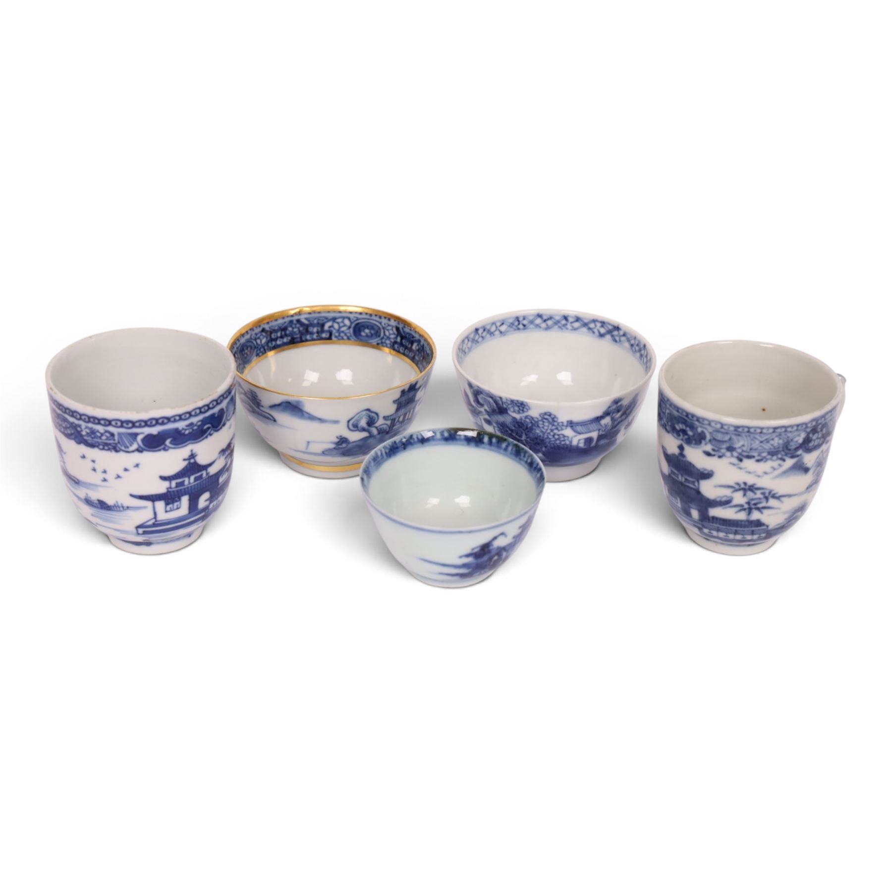 18th century Chinese blue and white ‘Nanking Cargo’ tea bowl and saucer, painted with pagoda in a landscape, with Christie's lot label No 5110, together with another tea bowl with similar decoration and gilt detail and other blue and white