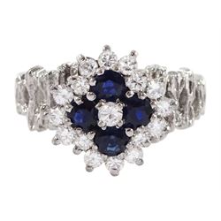 White gold sapphire and round brilliant cut diamond cluster ring, with pierced design shoulders, stamped 18ct, total diamond weight approx 0.55 carat