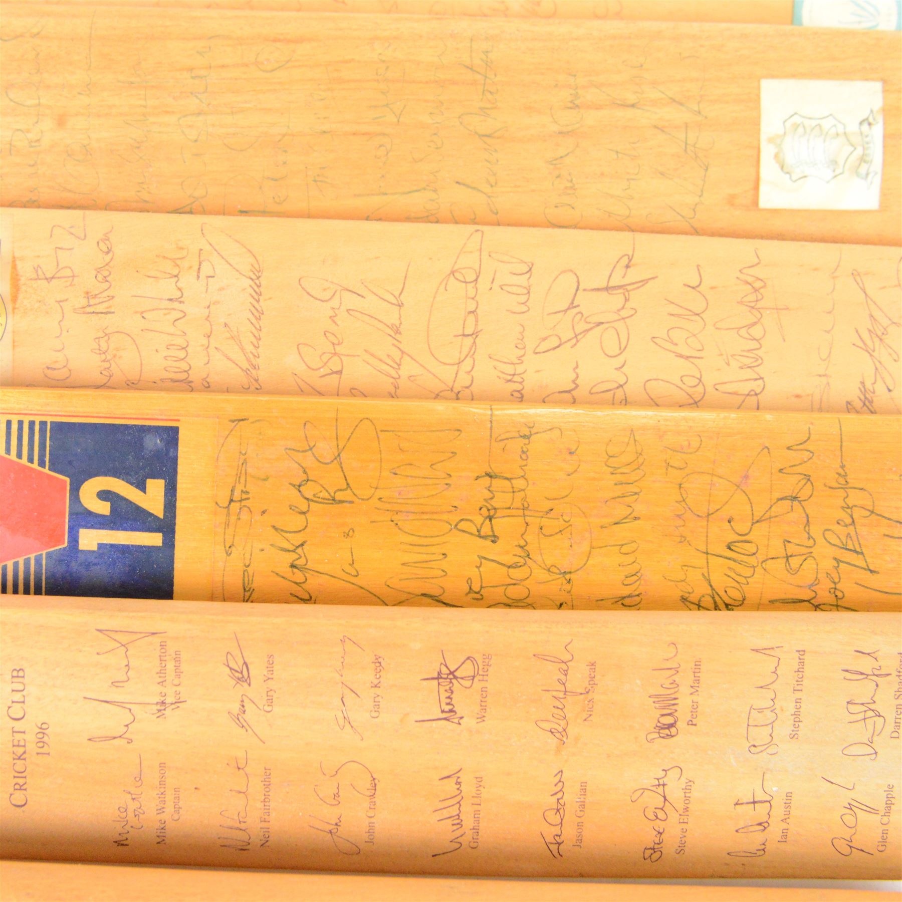 Sixteen signed miniature cricket bats, signed by 1990s County Cricket teams, including Northamptonshire 1992, Lancashire 1996, Surrey 1994, Essex 1991, Richard Blakely Benefit 1998, Worcester 1990 and Glamorgan 1994