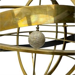 19th century brass terrestrial armillary sphere on rosewood base, lobe carved column on three splayed supports with scrolled carved terminals, the supports united by circular compass with turned stretchers