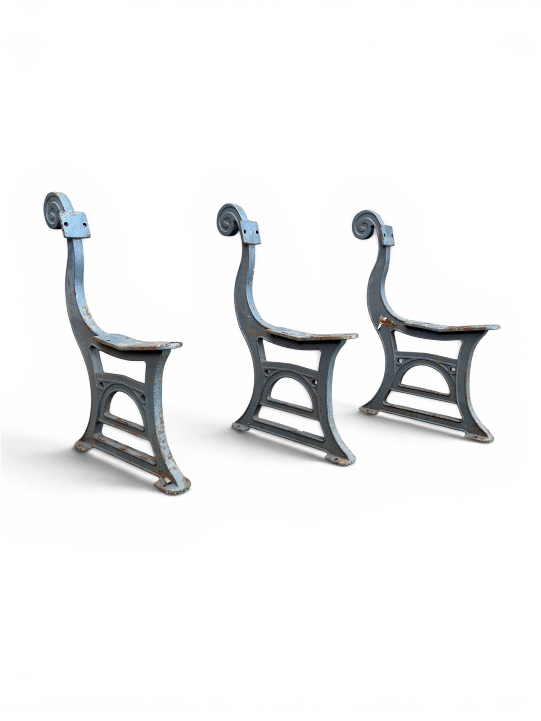 Set of three mid-20th century cast iron towns and park bench ends, scrolling pediment over arched stretchers, length to be altered as desired