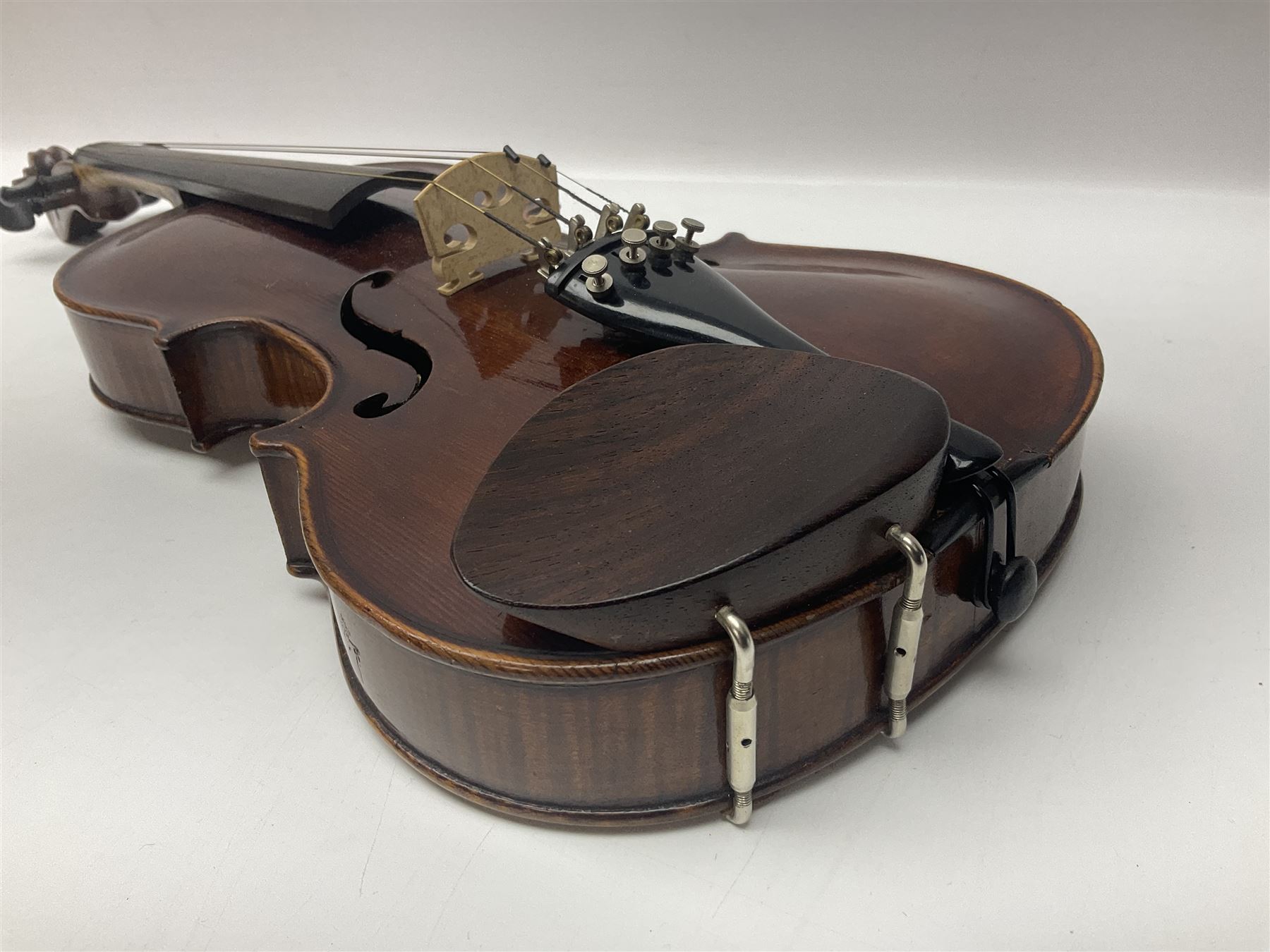 German trade violin in the Steiner style c1900 with 35.5cm two-piece maple back and ribs and spruce top L59cm overall; in fitted carrying case with two bows; and a Saxony violin with 35.5cm one-piece maple back and ribs and spruce top L58.5cm overall (2)