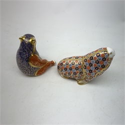 Two Royal Crown Derby paperweights, the first modelled as a Honey Bear, the second as a Walrus, each with print mark beneath, and gold stopper. 
