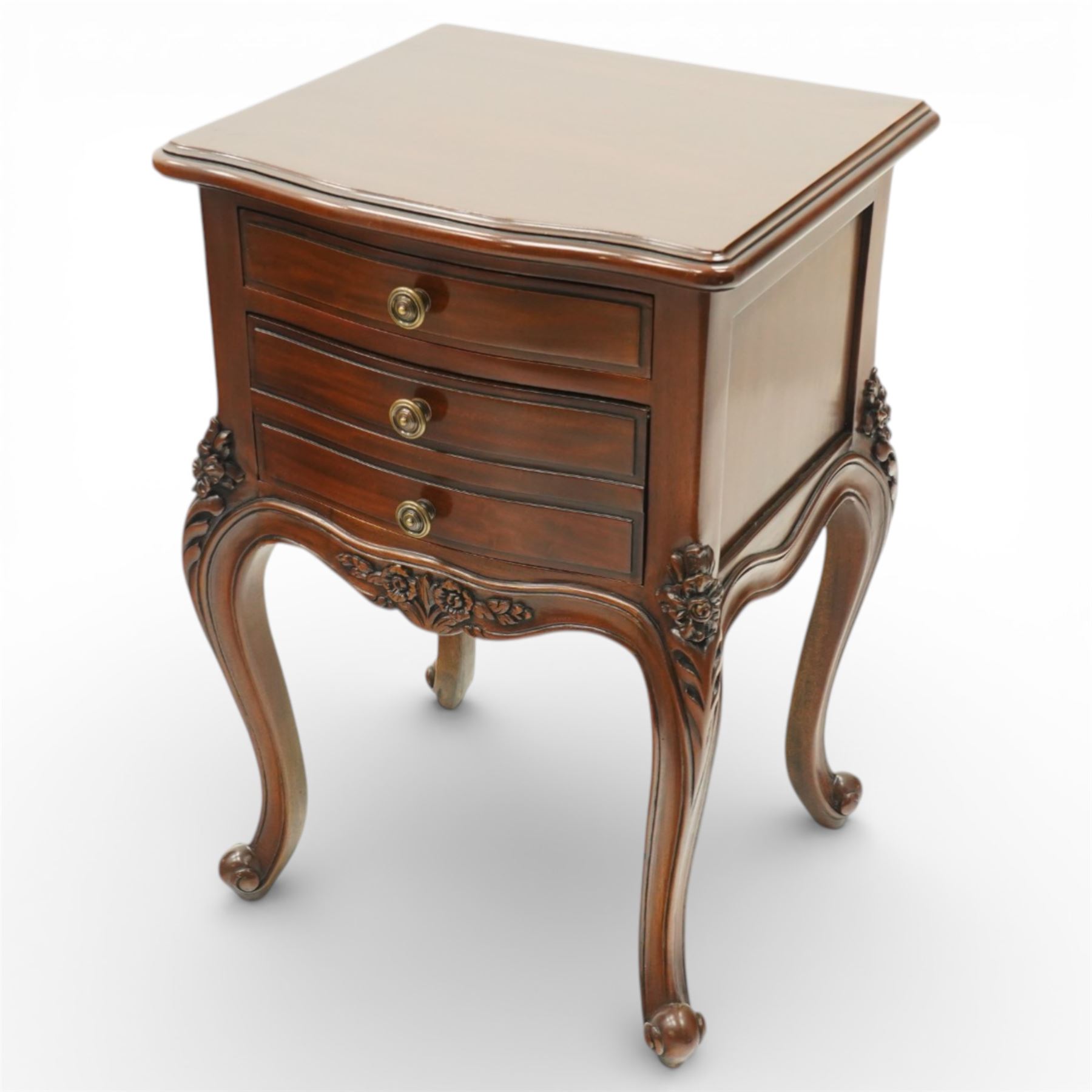 Pair of French Rococo design bedside chests, with serpentine fronts, two drawers, brass handles and carved floral decoration, raised on cabriole legs with scroll feet
