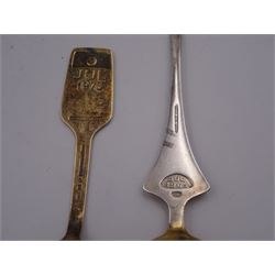 Two Danish silver-gilt year spoons by Georg Jensen, the first example decorated with enamel blue cornflower motif, dated 1972, in original pouch, the second example decorated with enamel pink briar rose motif, dated 1976, in original box, each impressed on underside RA AB, Sterling Denmark, and marked for Georg Jensen, together with two further examples by A.Michelson, the first with orange enamel fan design, dated 1965, impressed on underside A.Michelsen Sterling Danmark, TH, the second with enamel family scene, dated 1973, impressed on underside 925 S A.Michelsen Sterling Danmark, B Spang Olsen, approximate gross weight 6.11ozt (190.4 grams)