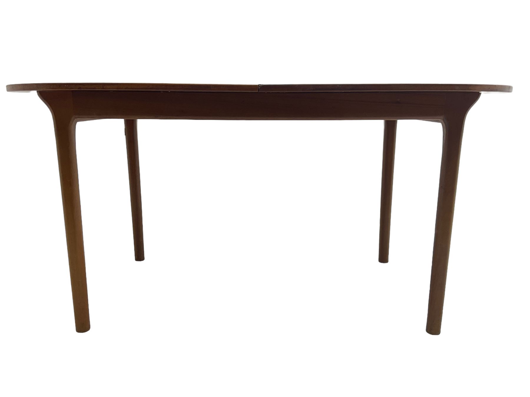 AH McIntosh & Co of Kirkaldy - mid-20th century teak extending dining table, rectangular top with rounded corners, concealed integrated double leaf, raised on tapered supports, 'Furniture by McIntosh sticker to underside of leaf
