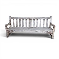 Teak garden bench with slatted back and seat on square supports in weathered which finish 