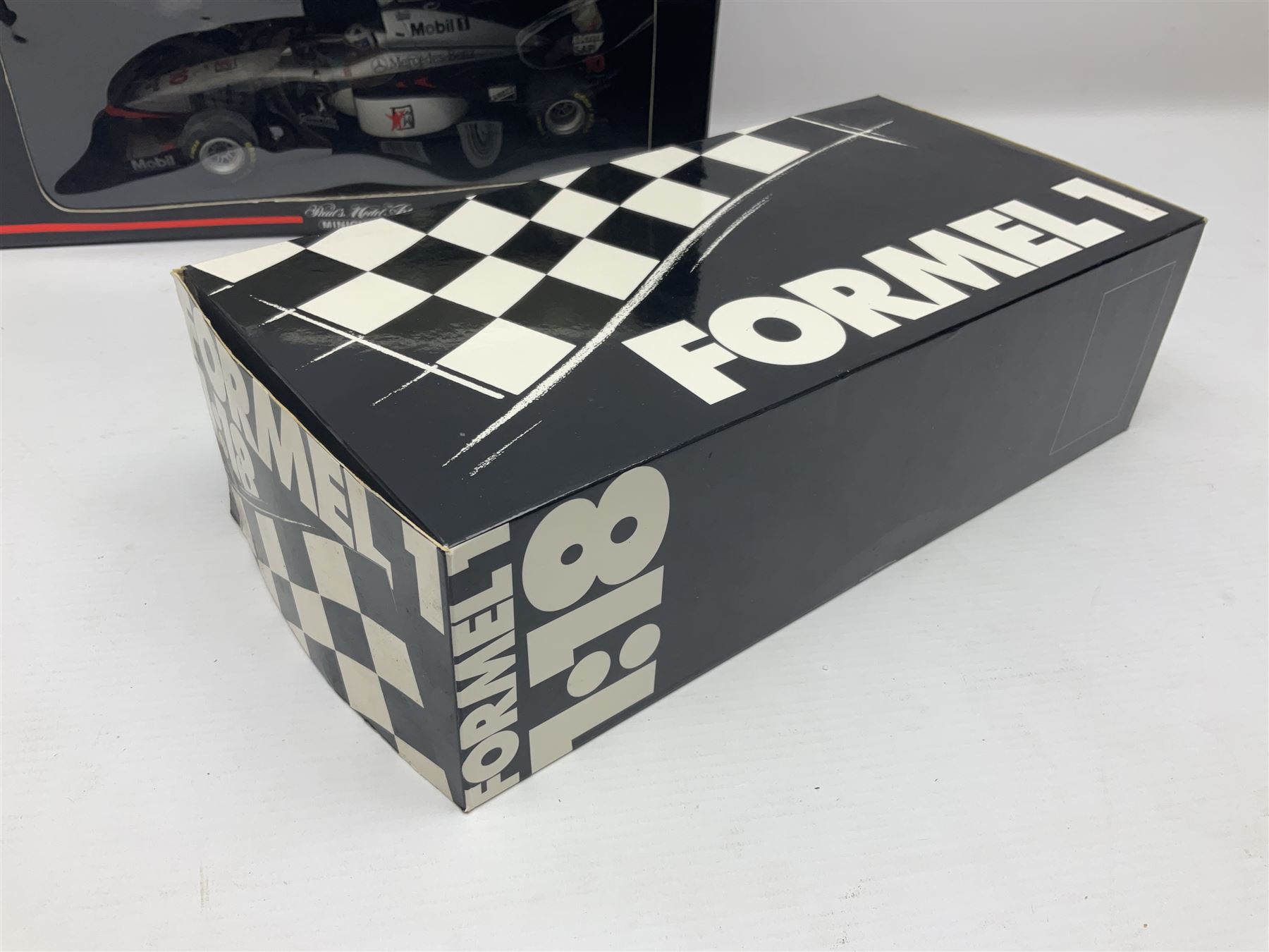 Four Minichamps 1:18 scale die-cast racing cars - Williams F1 Team BMW FW26 R. Schumacher; McLaren Mercedes MP4-12 D. Coulthard; McLaren Mercedes MP4-13 M. Hakkinen; and Formel 1 Jordan peugeot EJR 195 E. Irvine; all boxed (4)