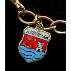 9ct rose gold curb link charm bracelet with yellow gold clip and four 9ct gold charms including, horseshoe, clown, bananas and enamel Scarborough charm