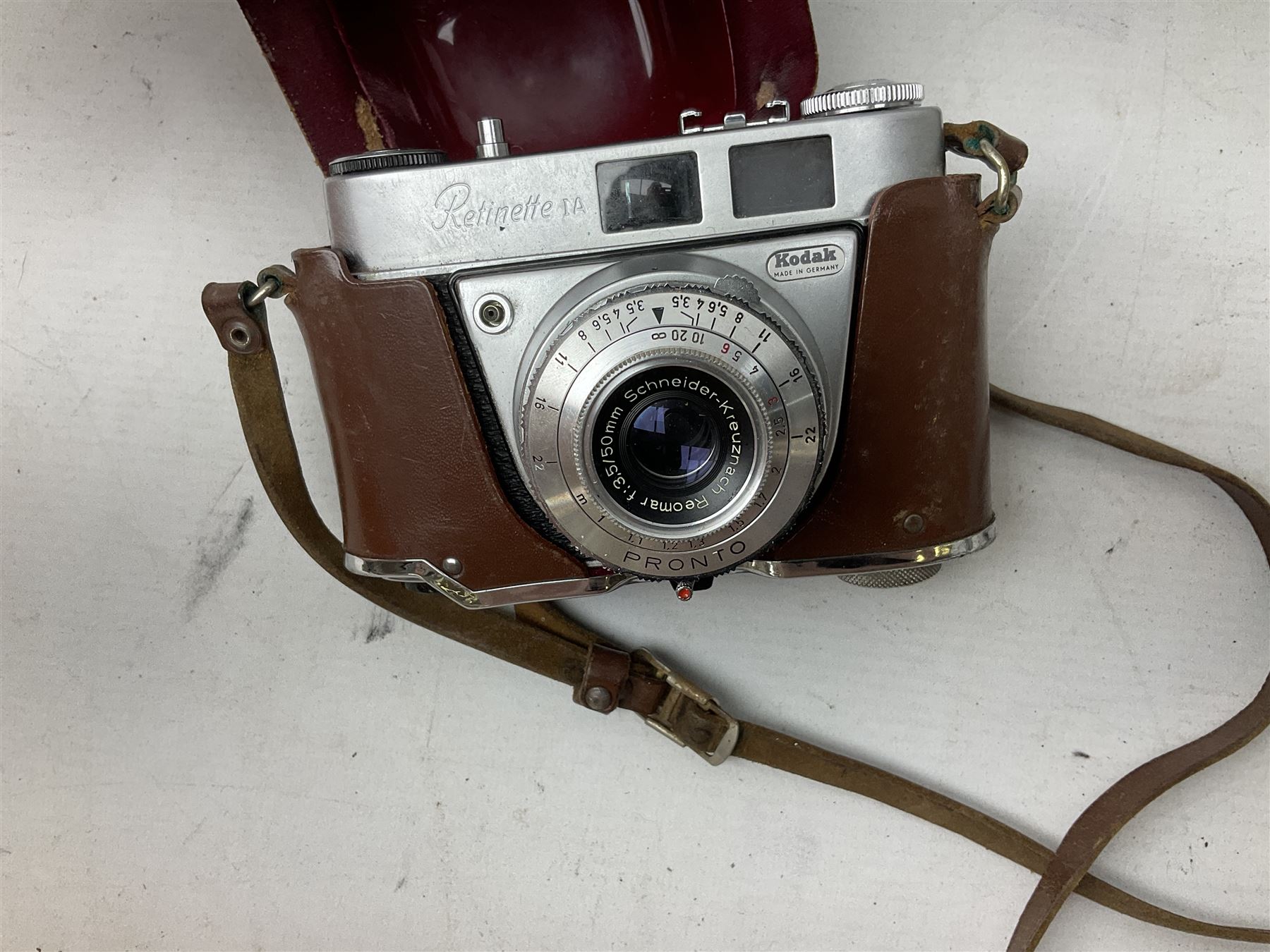 Cameras and camera equipment, including Kodak Retinette 1A, Polaroid J33 land camera, Kodak Colour snap 35, Agfa Isola I, three tripods etc,  