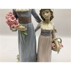 Lladro figure, Sisters, modelled as two sisters holding a basket of flowers and a floral bouquet, no 5013, year issued 1978, year retired 1991, H32cm  