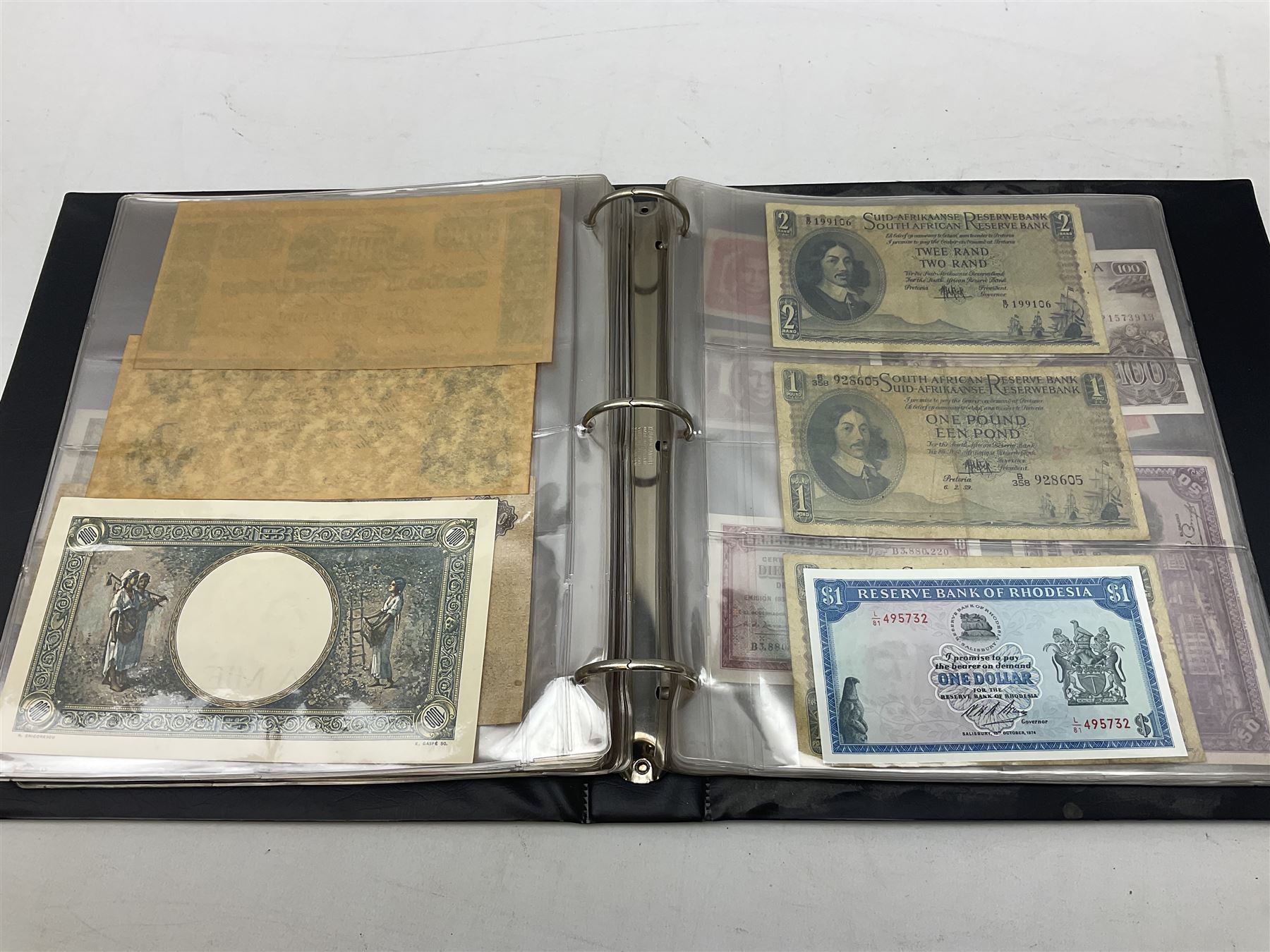 World banknotes, including Queen Elizabeth II The States of Jersey one pound 'DB202703', five pounds 'BB527762' and ten pounds 'AB651481', reserve bank of New Zealand two dollars '1L3 741894', King George V Straits Settlements one dollar 1st January 1935 'F/83 28924', various Bank of England notes etc, housed in two ring binder albums
