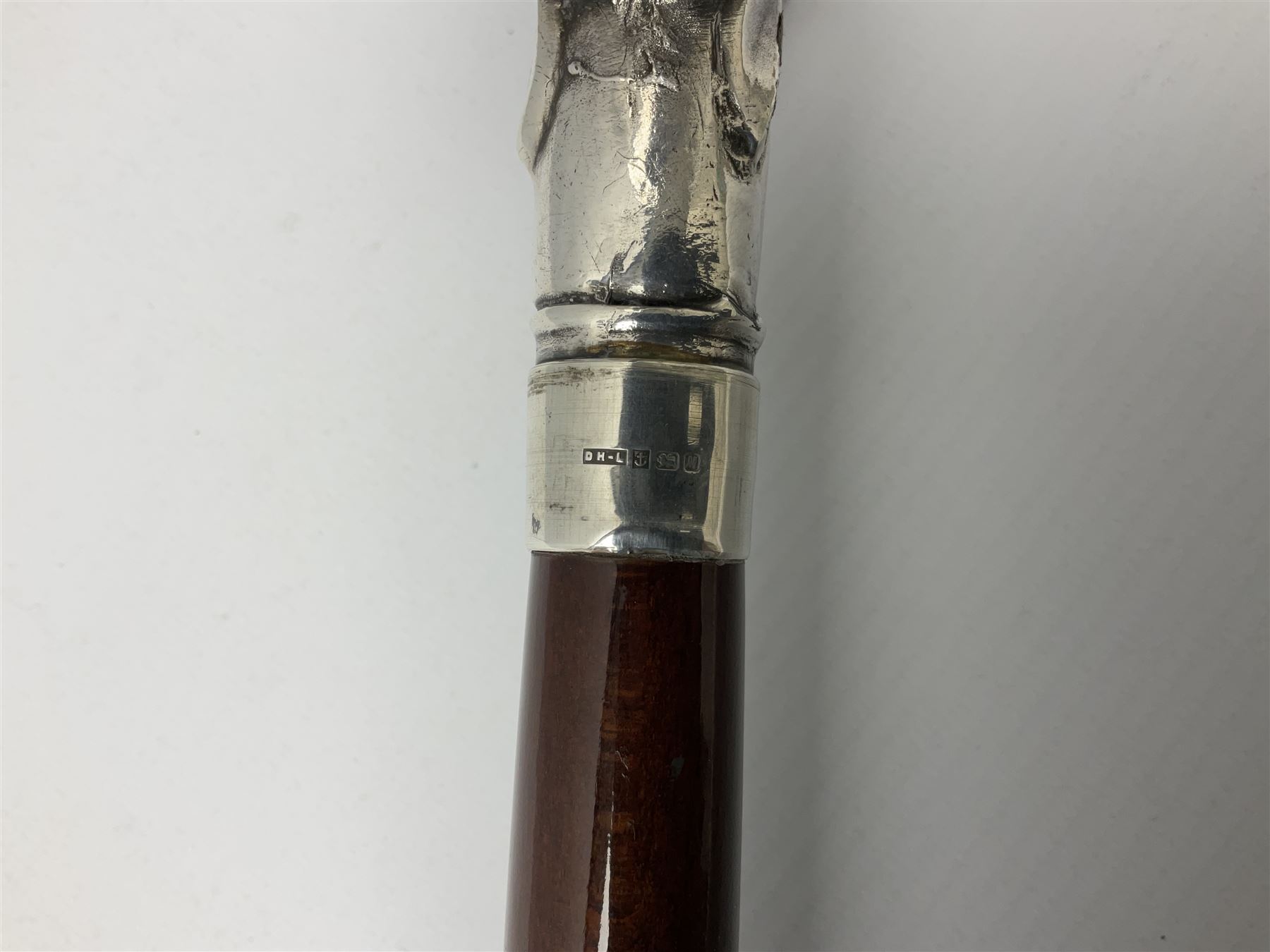 Art Deco style Italian 'Rivestito' covered silver walking stick handle, modelled in the form of a swan, stamped 'R', upon a silver collar hallmarked Birmingham 1986, makers mark DH-L, and hardwood shaft, L96cm

Provenance by vendor repute: 
This walking cane comes from a private collection amassed by the current vendors mother who was an Antique dealer specialising in walking sticks, working at the Portobello Road Antique Market in London for over forty years. 
In 1988 the prop crew from LWT (now ITV) visited Portobello Road looking for, amongst other items, a signature stick for David Suchet to use in his portrayal of Agatha Christie's Poirot. 
At the time this particular walking stick was one of five in possession. The prop crew chose and purchased another of the five which was then used by Suchet throughout all seventy episodes of the much loved series. 
Following the conclusion of the series Suchet was gifted his particular cane, which has been loaned to and can now be seen at the Agatha Christie Gallery at the Torquay Museum. 
