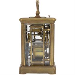 French-19th century 8-day carriage clock in a corniche case, two train striking movement with repeat work and alarm, enamel dial with Roman numerals and five minute Arabic’s, spade hands and alarm setting dial, movement with a lever platform escapement sounding the hours and alarm on a gong. With original case and key.