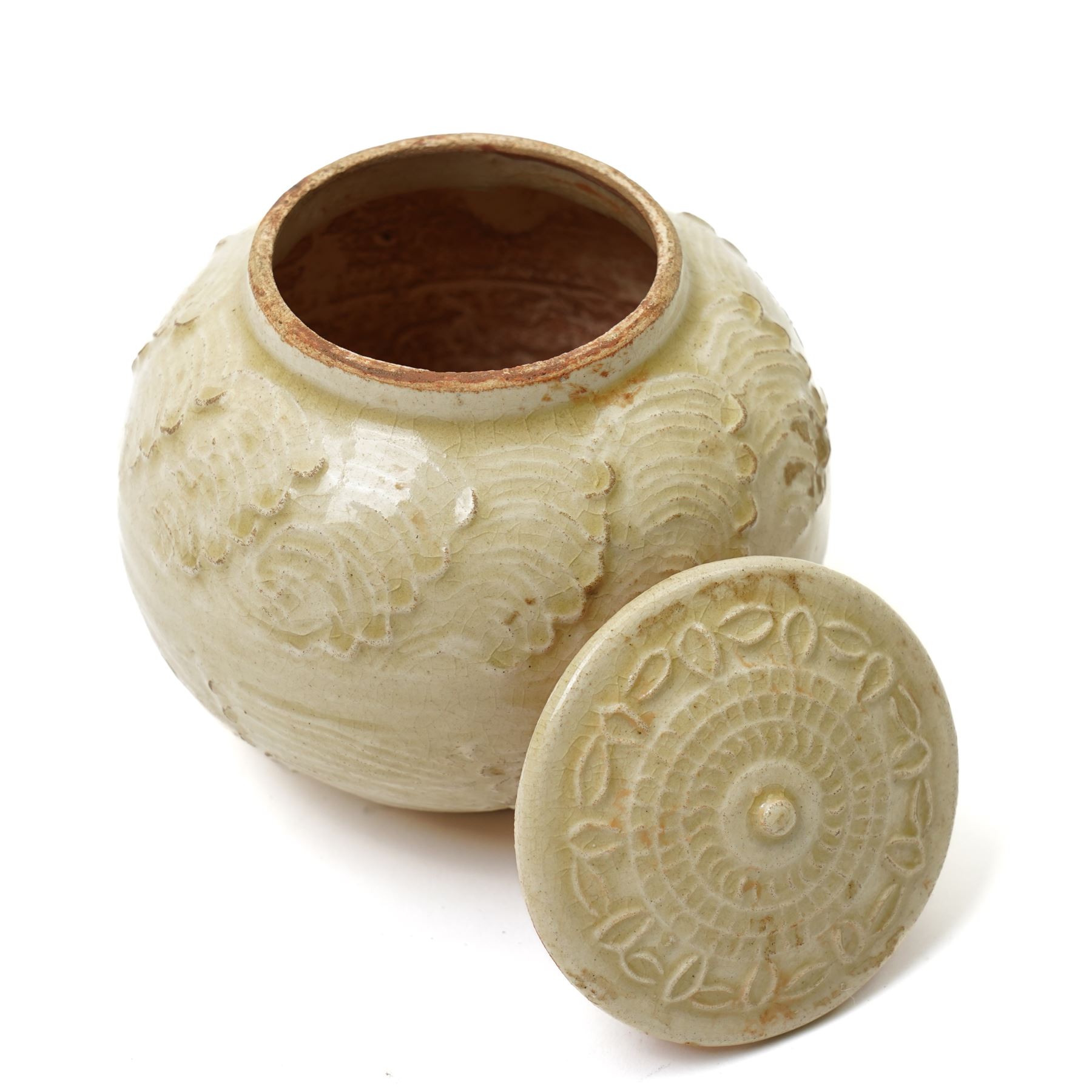 Chinese celadon glazed jar, possibly Ming dynasty, with moulded repeating decoration, 9.5cm