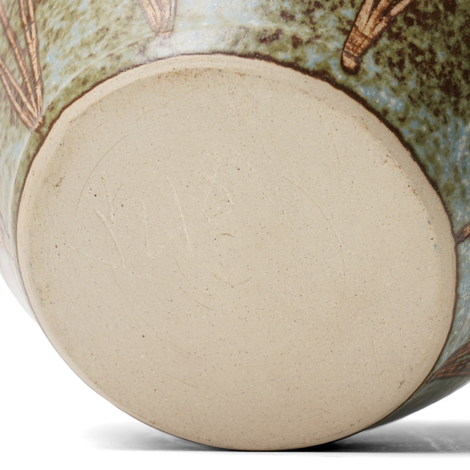 John Egerton (c1945-2024): Stoneware planter, decorated with carved flower motif, mottled blue background and scalloped rim, marked beneath, H18cm
