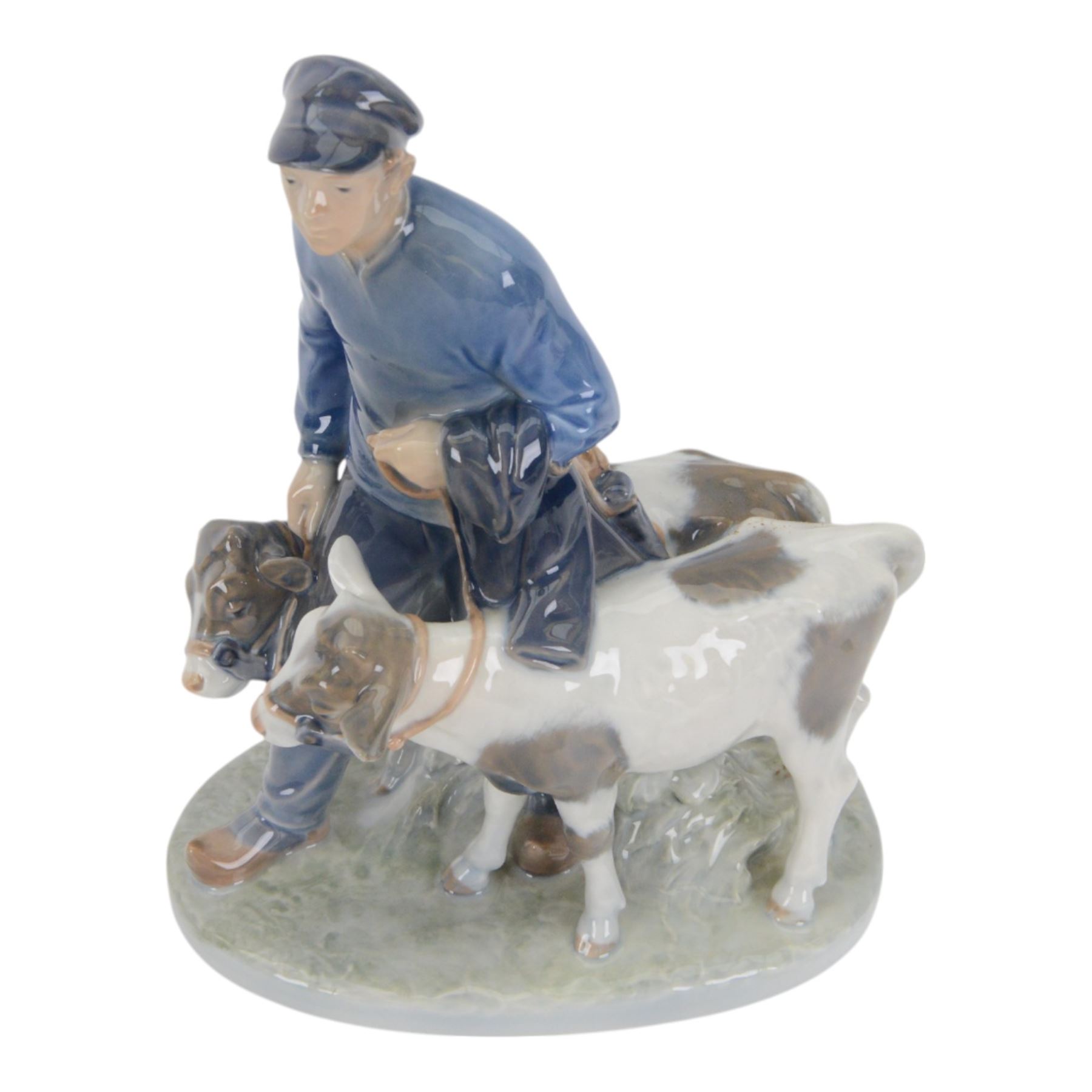Five Royal Copenhagen porcelain figures of farm animals, comprising Boy with Pig no 848, Boy with Calf no.772, Boy with Sheep no 627, Boy with Calf's no.1858, Girl with Goats no 694