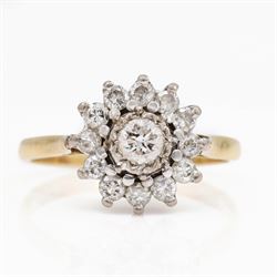 Gold diamond flower head cluster ring, single round brilliant cut diamond, surrounded by t...