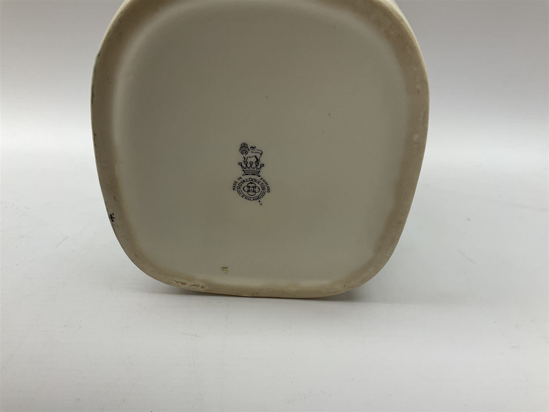 Pair of Royal Doulton Toby Ale Jugs, produced in 1934 for Charrington Ales, together with two circular metal serving trays advertising Charrington brewery, a Charrington badge awarded for 25 years of service and a 1949 menu Fox & Nicholl Ltd annual dinner dance at the toby jug hotel.  