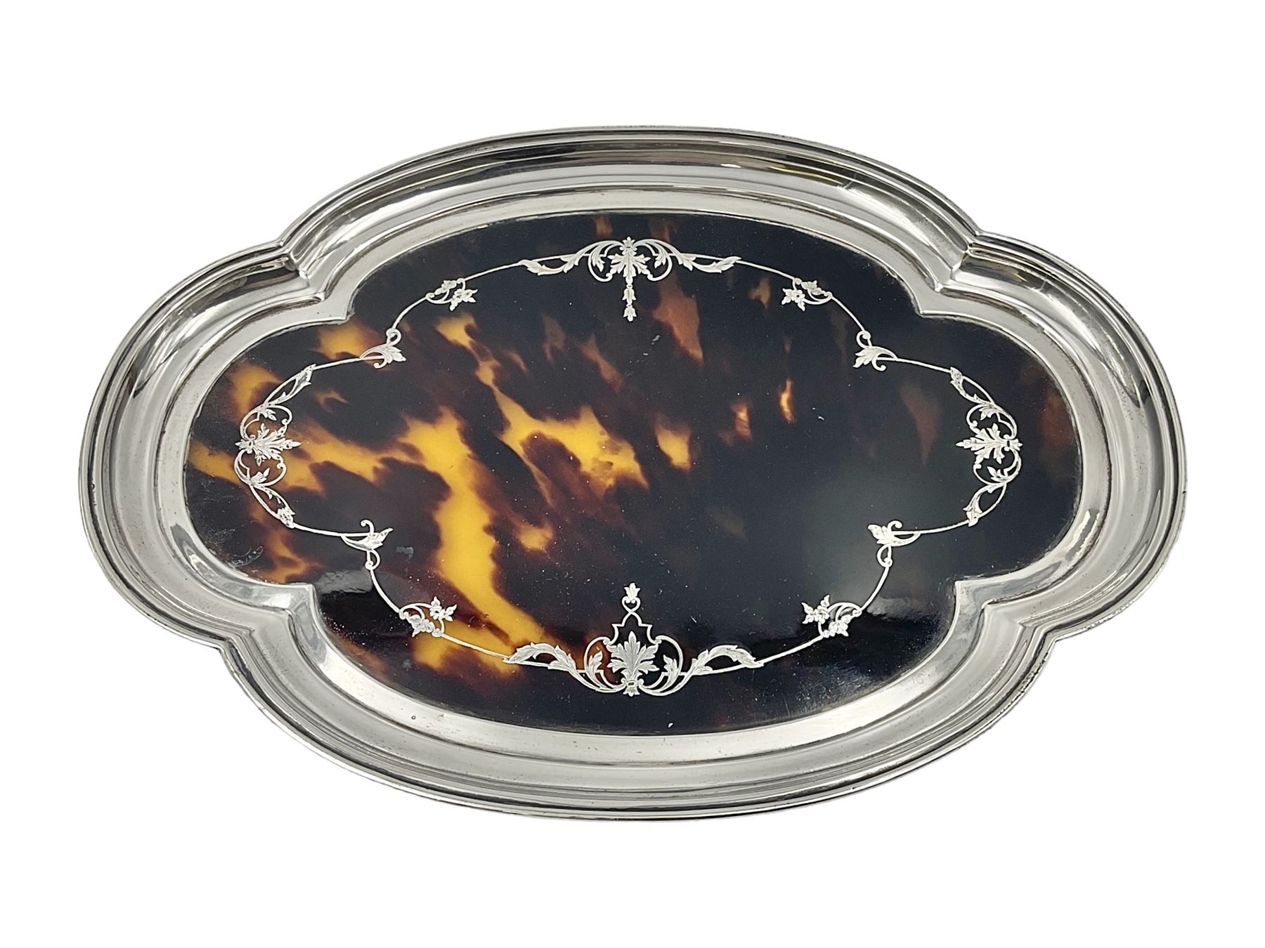 1920's silver and tortoiseshell dressing table tray, of quatrefoil form, the lobed silver edge encasing a tortoiseshell center with silver acanthus detail, hallmarked Elkington & Co Ltd, Birmingham 1921, L25cm W18cm