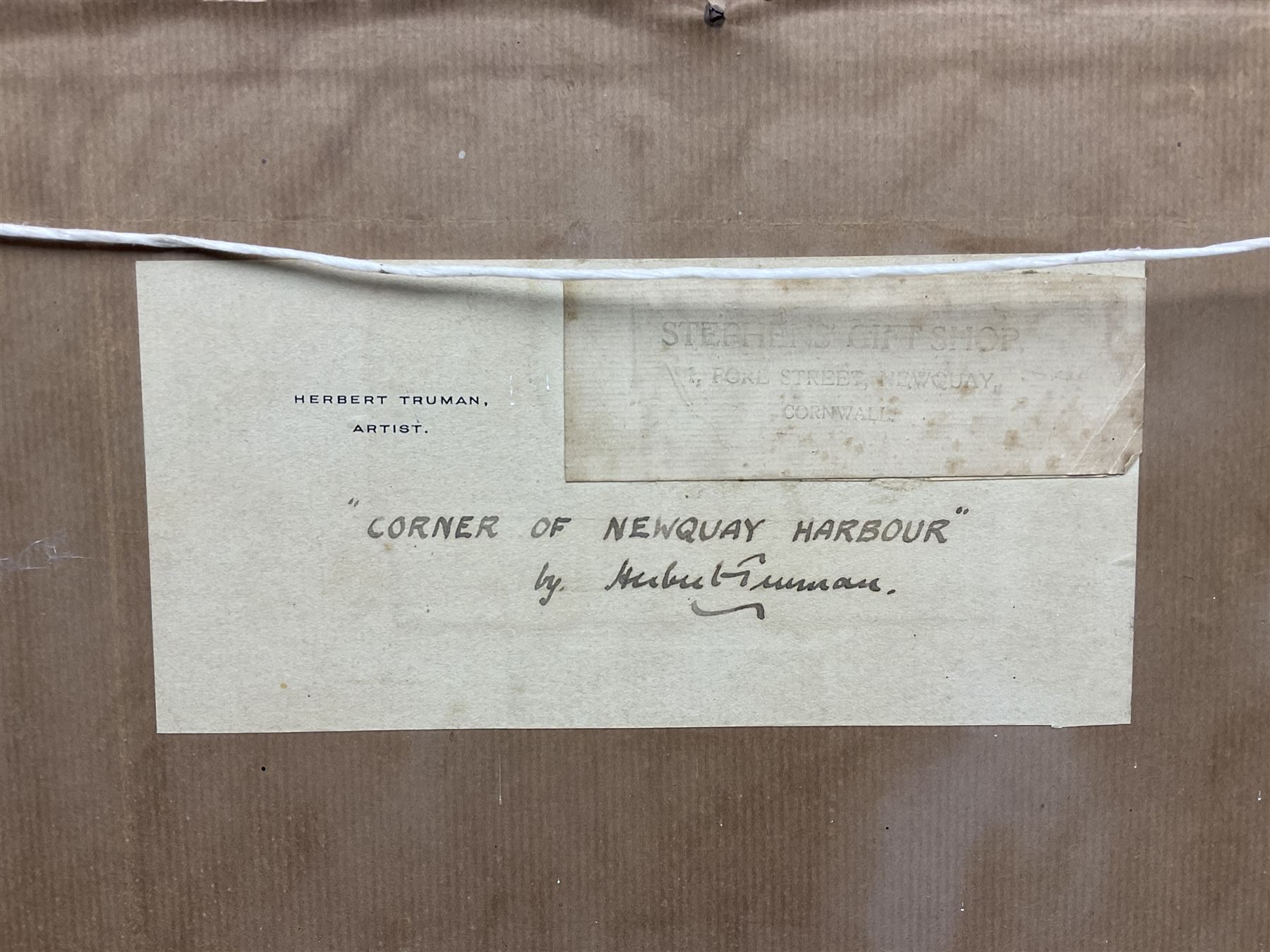 Herbert Truman (St. Ives 1883-1957): ‘Corner of Newquay Harbour’, oil on board signed, titled on label verso 31cm x 45cm