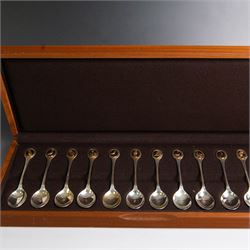 Royal Society for The Protection of Birds silver spoon collection, twelve spoons each inset with a silver-gilt bird cameo, hallmarked John Pinches Ltd, London 1975, in wooden presentation case with certificate of authenticity