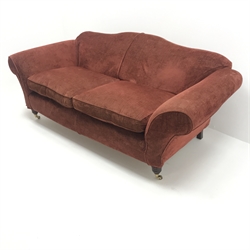 Multi-York three seat sofa, upholstered in a maroon fabric, shaped back, scrolling arms, turned supports on castors, W210cm 