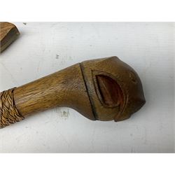 Malaysian parang survival knife the 29cm steel blade with character marks, cane bound teak grip carved with a stylised turtle head to the pommel, with matching teak scabbard L46cm overall