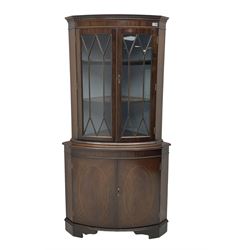 Regency design mahogany standing corner cabinet, astragal glazed doors over double cupboard 