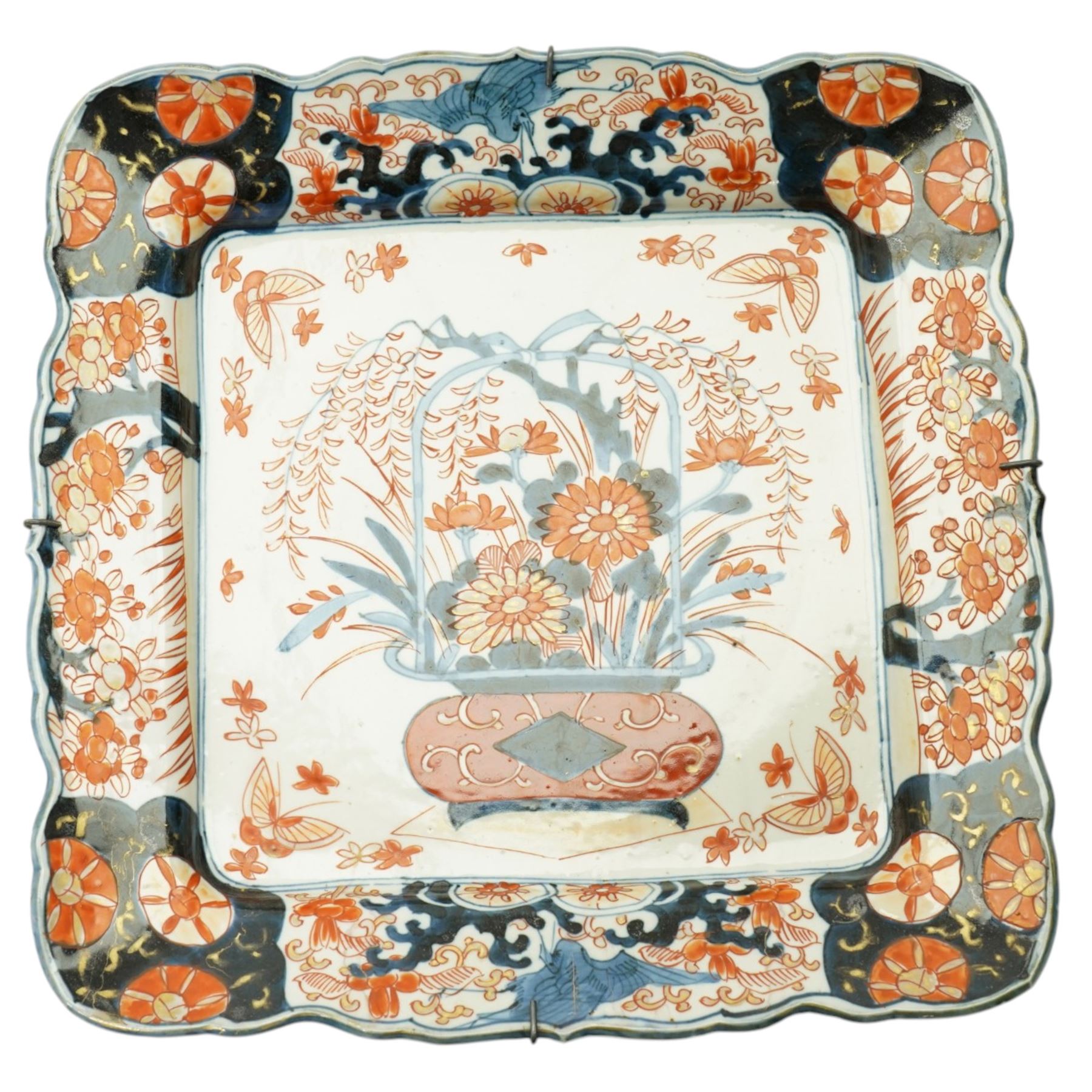 Late 19th/early 20th century Japanese Imari square dish decorated with flowers 32cm and an Indian linen wall hanging decorated with elephants, carriages etc in procession 56cm x 170cm