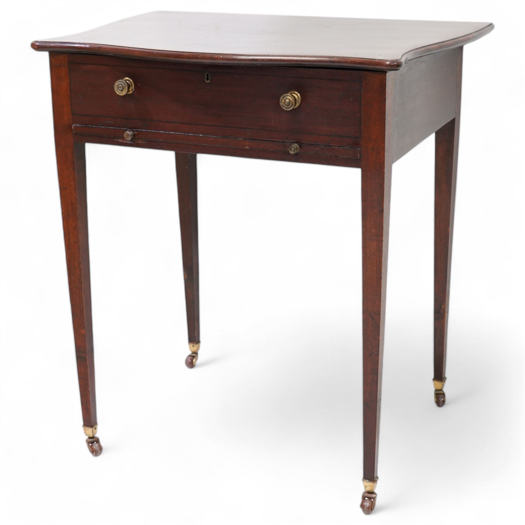 Edwardian mahogany sewing or work table, of shaped form, moulded hinged lid enclosing lidded compartments, fitted with slide, on square tapering supports with brass and ceramic castors 