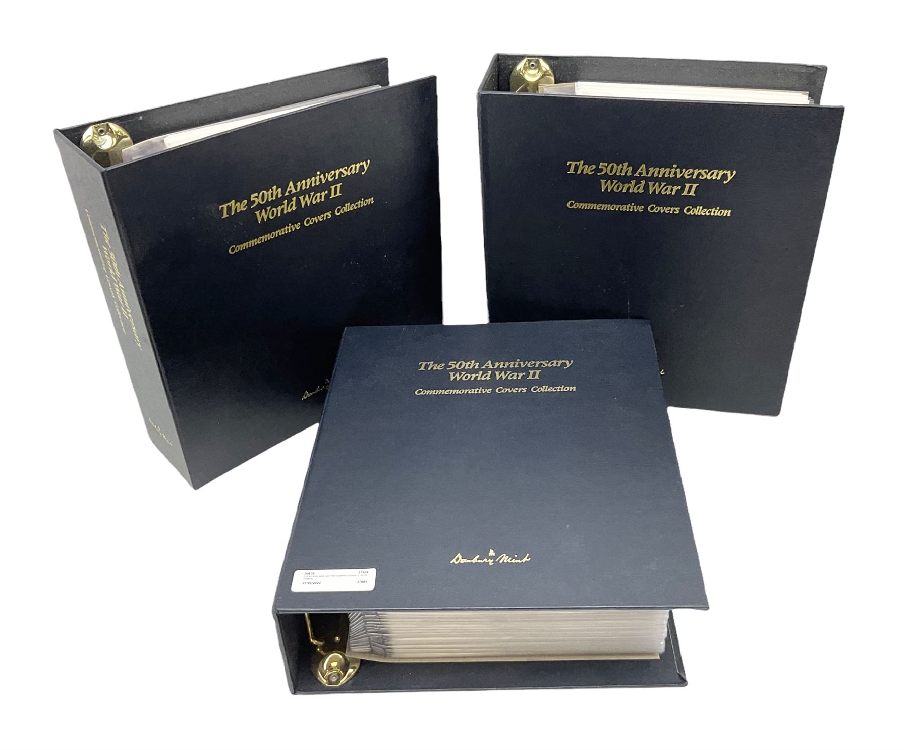 Three albums of 'The 50th Anniversary World War II Commemorative Covers Collection', housed in the official Danbury Mint folders